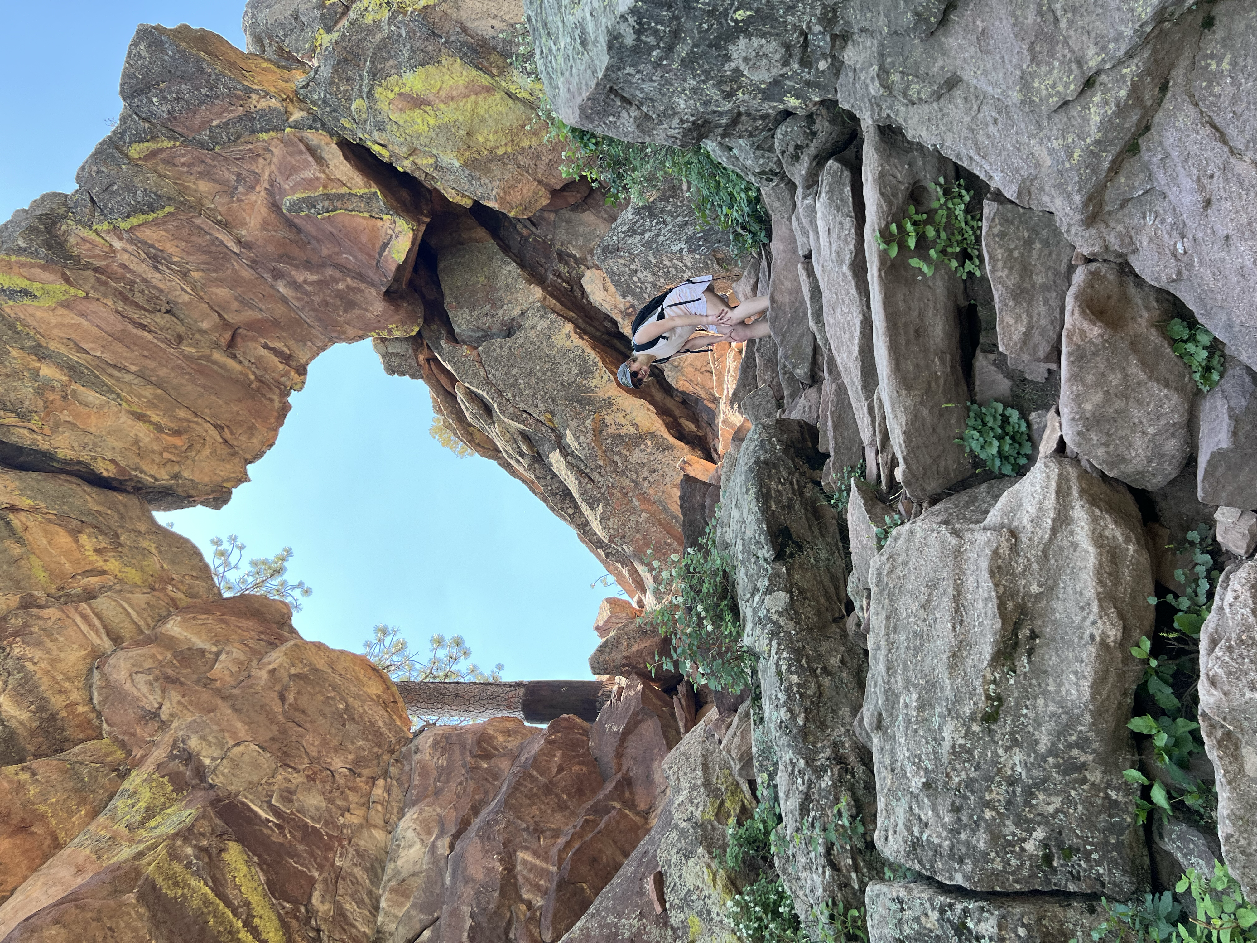 Mara out of breath in front of the Royal Arch in Boulder.