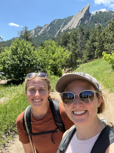 Mara and Rachel with the Flatirons in the background.