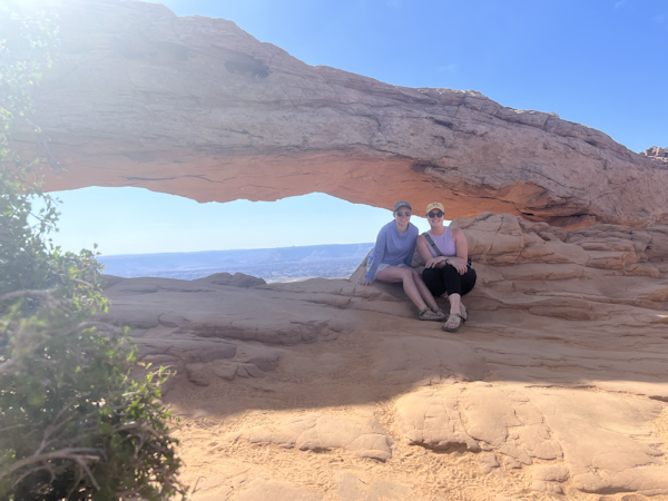 Mara and Julia at Mesa Arch in Canyonlands National Park