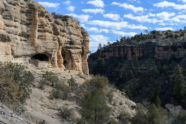 A side look of a cliff with dwellings