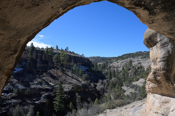 Looking through a stone archway towards a valley