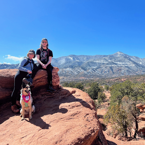 Our Marketing Manager on a hike with her husband and dog